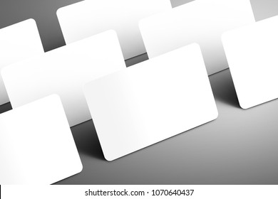 Business  mockup of a few blank gift (bank) card with shadows isolated on a gray background. Ready to used in your design.
