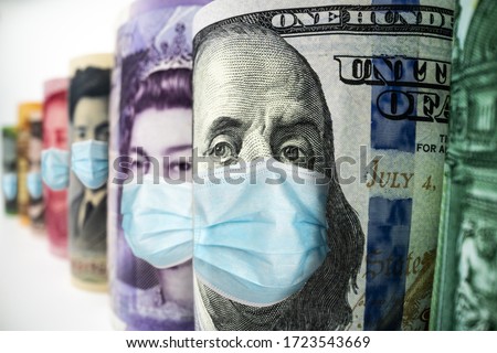 Business and money in covid 19 crisis - International money wearing face mask effected by covid 19 outbreak in concept of money saving and money investment under covid 19 situation.