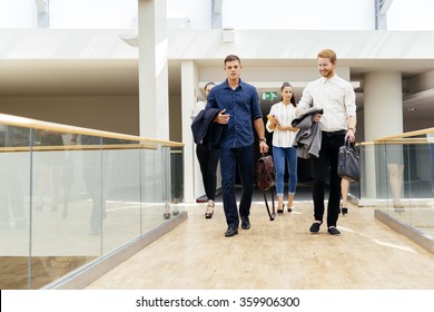 Business in motion, walking business people