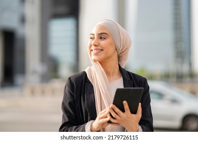 Business Muslim Woman Using Tablet Outdoors, Happy Arab Girl Standing Outdoors And Checking Email On Digital Device