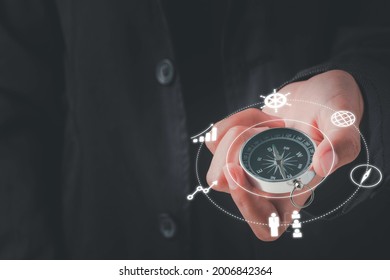 Business Navigate Concept, Businessman Holding Compass Navigation For Guide To Recovery Business Planning Growth In The Economic Crisis And Trading Graph Financial Data, Action Plan Icon.