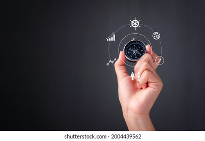 Business Navigate Concept, Hand Holding Compass Navigation For Guide To Recovery Business Planning Growth In The Economic Crisis And Trading Graph Financial Data, Action Plan Icon.