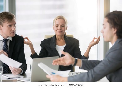 Business negotiation, male partners arguing, funny easygoing woman keeping calm in stressing situation, meditating with composed smile, dealing with emotional angry customer, stress management concept