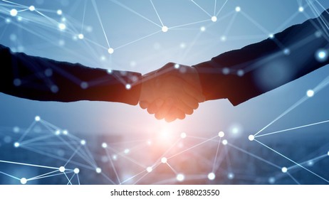 Business network concept. Teamwork. Partner ship. Shaking hands. - Shutterstock ID 1988023550