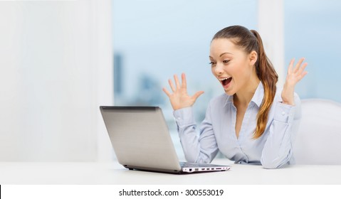 Business And Office Concept - Surprised Businesswoman Using Her Laptop Computer