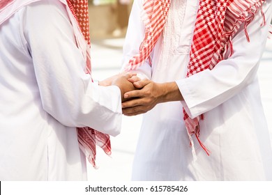 Business And Office Concept, Two Arab And Business Man Are Shaking Hand On Cityscape Background.