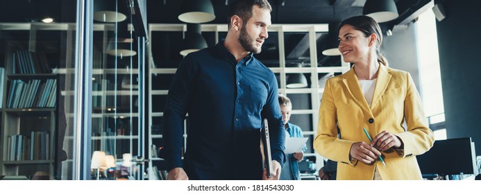 Business office concept. Two employees have a talk in big open space. Wide screen, panoramic - Shutterstock ID 1814543030