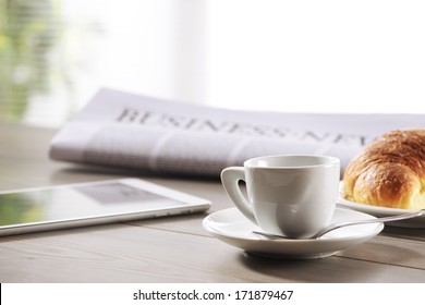 Business Office scene, digital tablet and newspaper with coffee  - Powered by Shutterstock