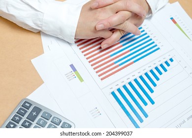 business, office, tax, school and education concept - woman hands with charts and papers  - Shutterstock ID 204399037
