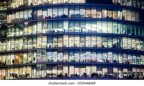 business office windows at night  Corporate building London City  England
