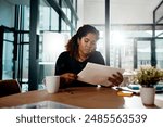 business, office and woman with documents at desk for evaluation, brainstorming or company planning. Government, public relations and employee with paperwork for campaign, strategy or investment idea