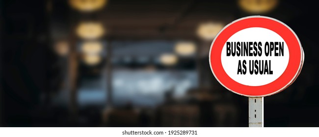 Business open as usual. circle sign stating business open as usual in front of restaurant or shop. Business open as usual sign during coronavirus covid-19 pandemic - Shutterstock ID 1925289731