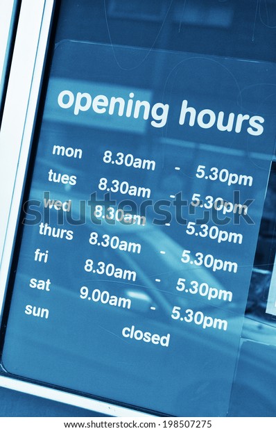 Business opening hours in\
shop window