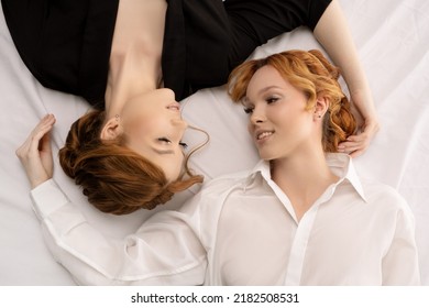 Business Over Bed - Stylish Young Businesswomen Lying In Black And White Cloth - Top View