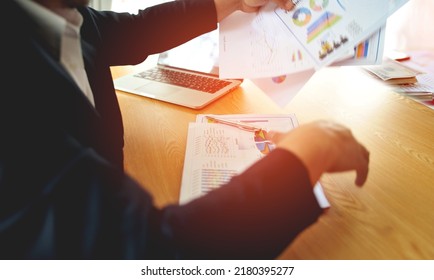 The Business Owner Is Busy Planning His Errands And Has A Laptop On His Desk.