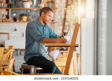 Business Owner, Cafe Manager Or Entrepreneur Writing Notes, Busy On Phone And Working On Laptop In His Startup. Young Male Looking Looking Satisfied Or Pleased While Managing Finance And Capital.