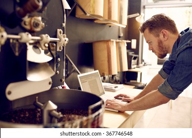 Business owner of a coffee roastery checking his laptop - Shutterstock ID 367746548
