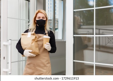 Business Owner Concept - Beautiful Caucasian Barista In Face Mask Offers Hot Coffee At The Modern Coffee Shop