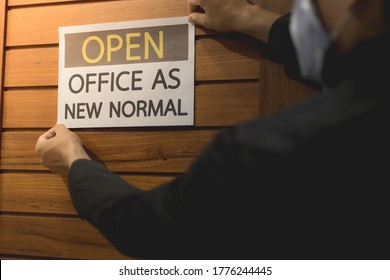 Business Owner Wears Masks To Label For Open Office. The Concept Is Opening Office After The COVID-19 Situation, Follows The New Normal Life. Select Tive Focus