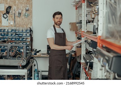 Business Owner Working On Workshop With Different Coffee Machines