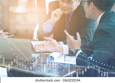 Business Partner Marketing Team Discussing Market Research And Brainstorming With Colleagues In A Meeting.  Professionals Having Meeting In Conference Room Looking At Computer Has Stock Market On Top 