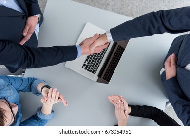 Business Partner Shake Hands On Meetinig In Modern Office Building Top View