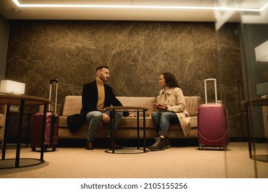 Business Partners, Businessman And Businesswoman Negotiating In A Private Meeting Room In The Airport Departure Terminal Meeting Room While Waiting To Board A Flight During A Business Trip.