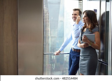 Business partners in the elevator