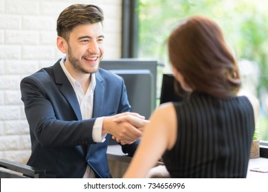 Business partners shaking hand after complete a deal. Business Corporate People Working Concept. Setup studio shooting. - Shutterstock ID 734656996
