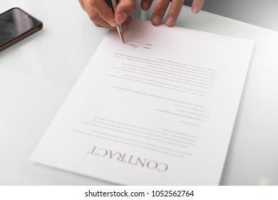 business partners signing contract about  invest in global market ; business partners review and analyze information report of economic investment at office - Shutterstock ID 1052562764