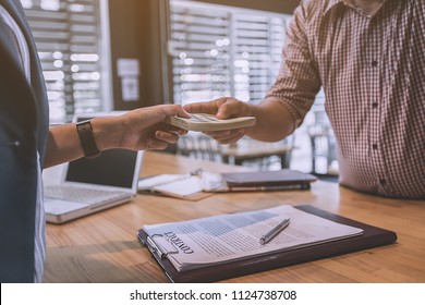 Business Partners Signing Contract To Borrow Money From Investor To Invest At Own Business