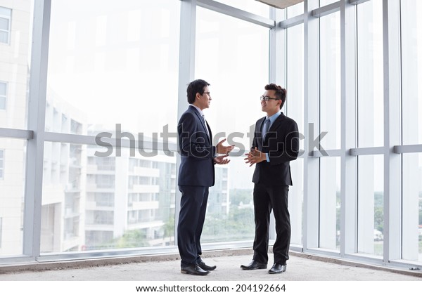images of people talking inside the office