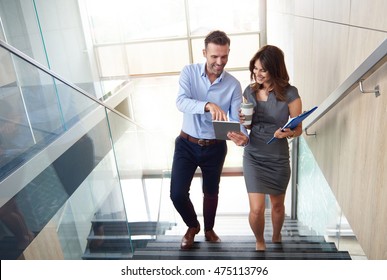 Business Partners Walking Up Stairs
