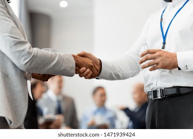 business, partnership and cooperation concept - handshake of people at international conference - Shutterstock ID 1471939424