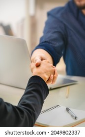 Business partnership coorperation concept. closeup of business handshaking. Successful and trust businessmen handshaking after agreement negotiation deal - Shutterstock ID 2049802337