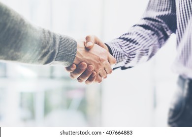 Business partnership meeting concept. Image businessmans handshake. Successful businessmen handshaking after good deal. Horizontal, blurred background - Shutterstock ID 407664883