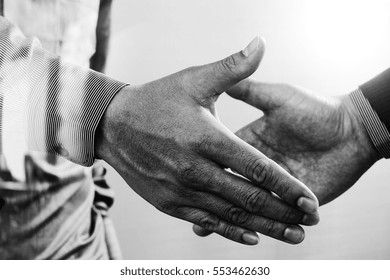 Business Partnership Meeting Concept.photo Businessman Handshake. Successful Businessmen Handshaking After Perfect Deal.close Up,black And White                               