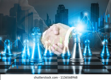 Business Partnership Successful And Strategic Plan Concept , 
Double Exposure Businessman Handshake On Financial Market Stock Chart With Chess Board Game Competition