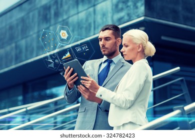 business, partnership, technology and people concept - businessman and businesswoman working with tablet pc computer charts on virtual screens on city street - Powered by Shutterstock