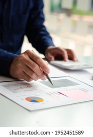 Business people or accountants are analyzing graphs on finance, investment, graph chart business strategy ideas, data analysis technology. - Shutterstock ID 1952451589