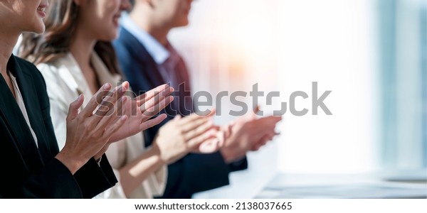 Business people applauding. Group of business\
people clapping in row. Banner\
background.