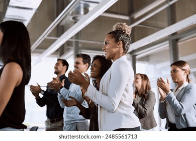 Business, people and applause for workplace presentation, audience and corporate with professional speech. Support, seminar and company conference with standing ovation, clapping and crowd approval - Powered by Shutterstock