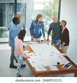 Business people, architect and teamwork in meeting with blueprint for building design, brainstorming and strategy. Architecture, employee and collaboration with floor plan in boardroom with top view - Powered by Shutterstock