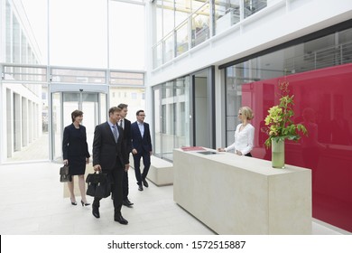 Business people arriving in offices - Powered by Shutterstock