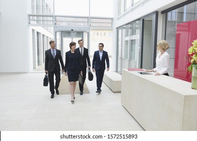 Business people arriving in offices