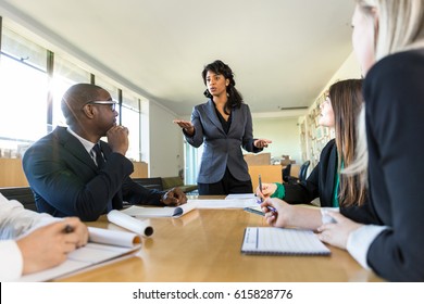 Business People Attentive Listening To Marketing Professional Female Executive Speaker Presentation