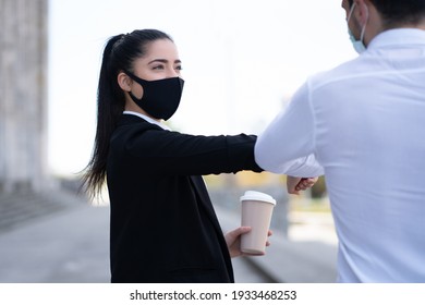 Business People Bumping Elbows For Greeting Each Other.