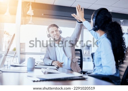 Business people, call center and high five for winning, teamwork or success in customer service at the office. Employee consultants touching hands in celebration for team win, bonus or promotion