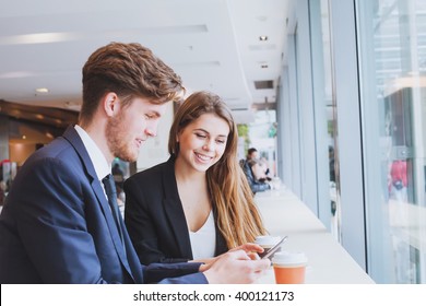 Business People Chatting In Cafe At Lunch Or Coffee Break