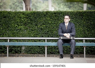 Business people in the city concept, Businessman waiting at the bus stop, clean city concept.